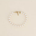 Bracelet - perles de résine blanche 6mm
