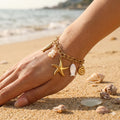Bracelet doré charms marins étoile poisson coquillage