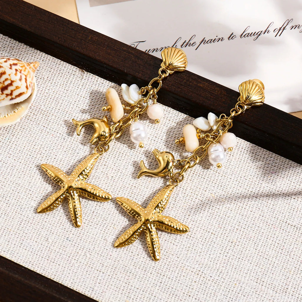 Boucles d'oreilles dorées pendantes étoile de mer, dauphin et pierres