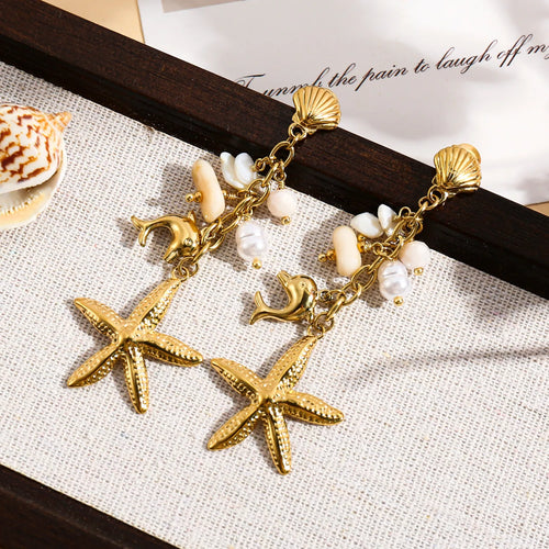 Boucles d'oreilles dorées pendantes étoile de mer, dauphin et pierres