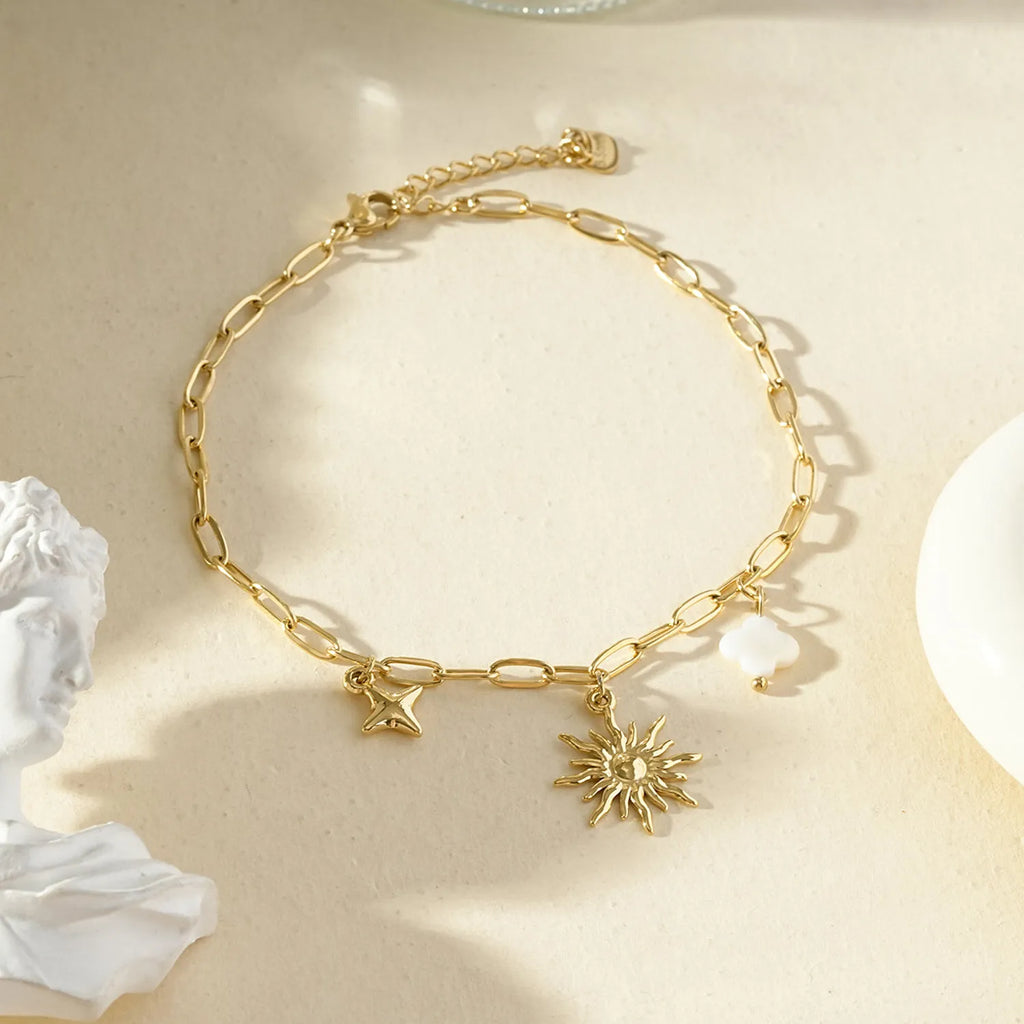 Chaîne de cheville dorée pendante soleil et étoile