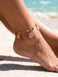 Chaîne de cheville dorée perles rosées et charms marins